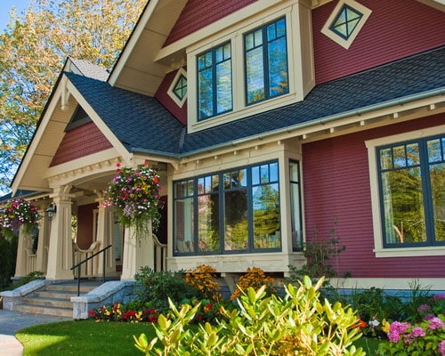 Red Siding Black Windows Cream Trim House