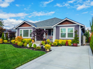 front entrance and yard of a nice house in the daytime